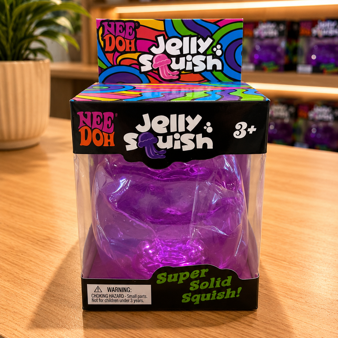 Jelly Squish toy packaging with colorful branding on a wooden surface.